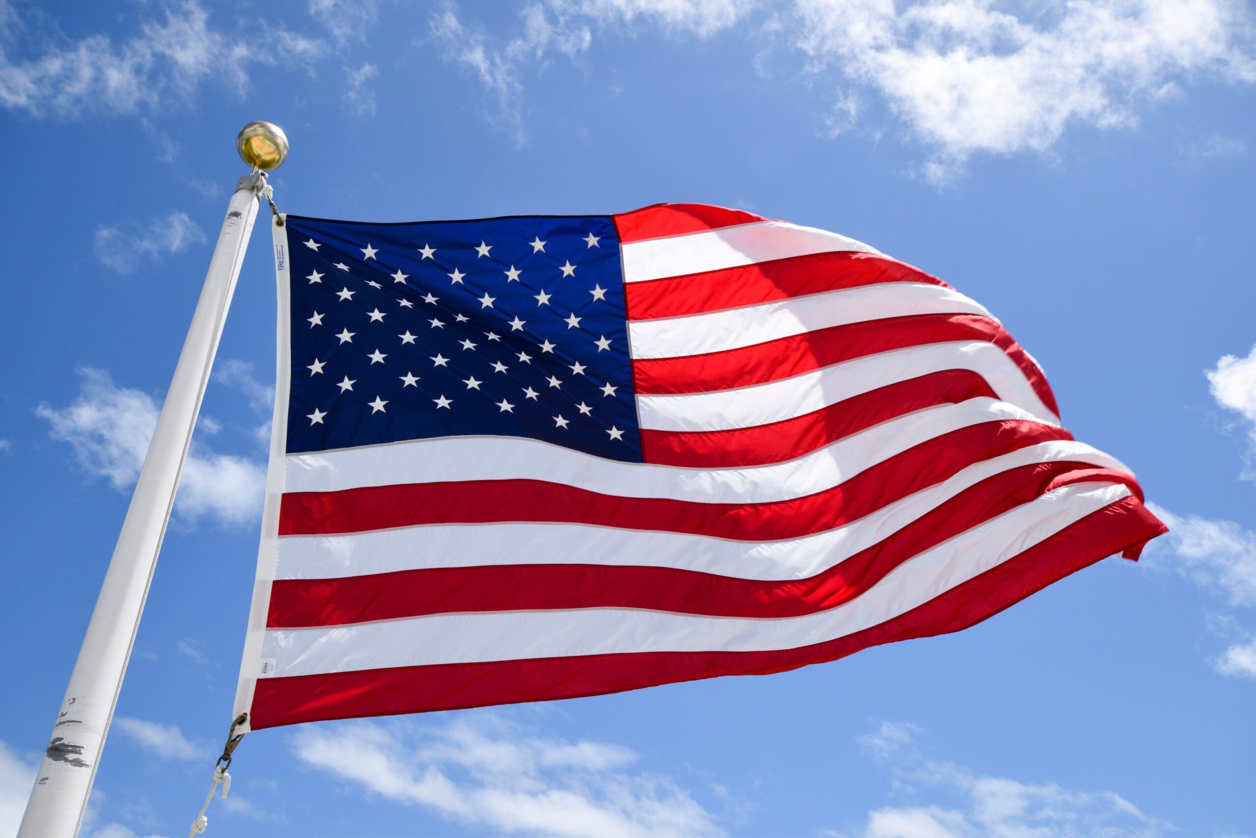 american-flag-flying-against-a-blue-sky